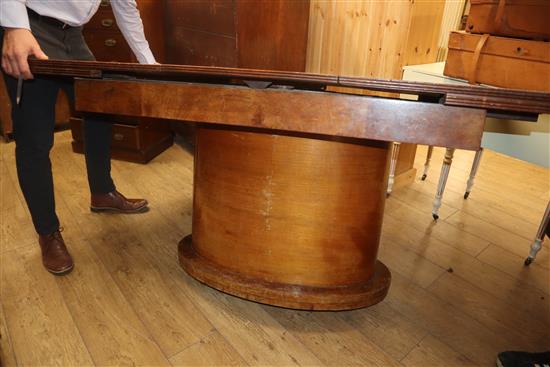 An Art Deco birds eye maple extending dining table 138cm